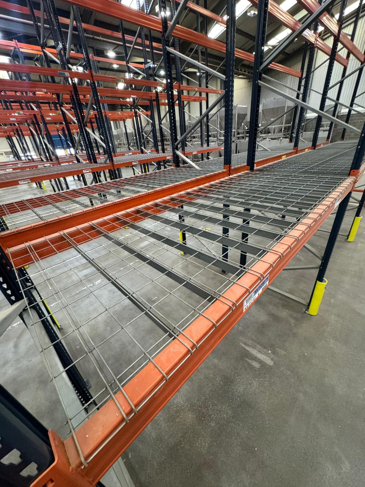 Orange column protector wrapping a blue racking upright